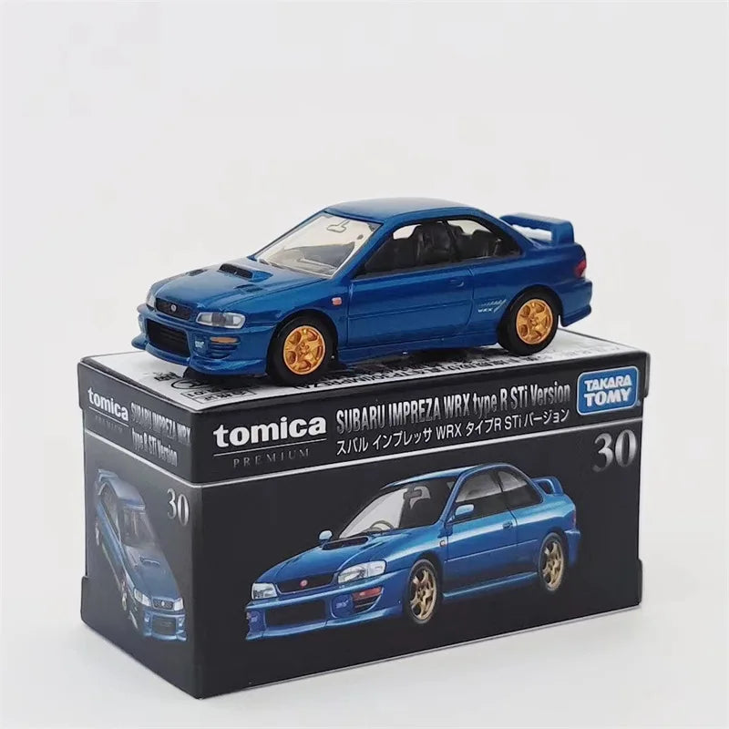 A blue Tomica Subaru Impreza WRX type R STI version die-cast model displayed on its packaging.