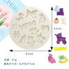 A set of silicone baby-themed cake molds including a stroller, bottle, pacifier, and other shapes.