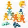 A set of wooden balance stacking blocks in various colors including yellow, green, blue, and orange.