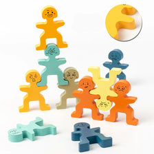 A set of wooden balance stacking blocks in various colors including yellow, green, blue, and orange.