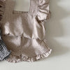 A beige gingham ruffle top and shorts set for a baby girl summer outfit.
