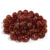 A pile of 50 imitation jade acrylic cloud beads in a reddish-brown color for jewelry making.