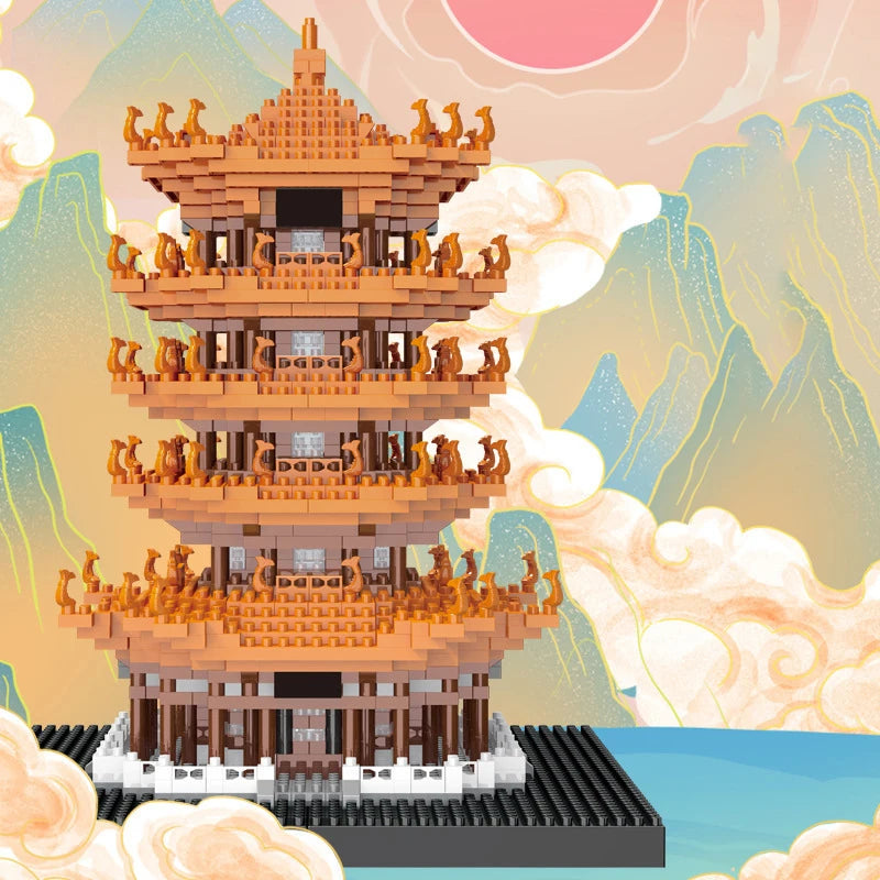 A detailed model of the Yellow Crane Tower built from micro building blocks, set against a soft, mountainous landscape.