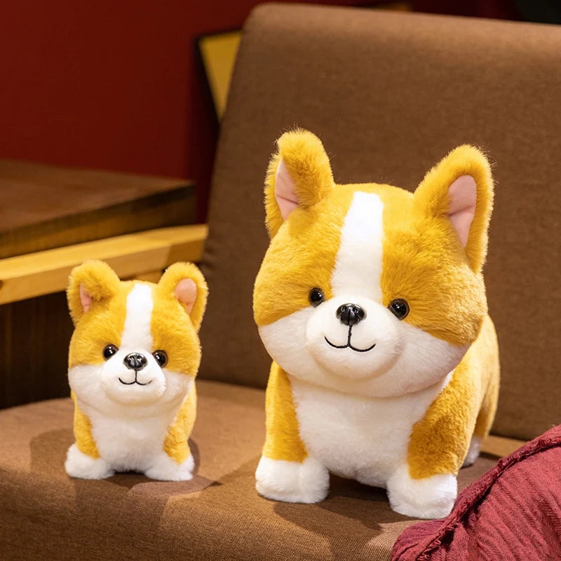 A yellow and white Corgi plush pillow sitting on a brown surface.