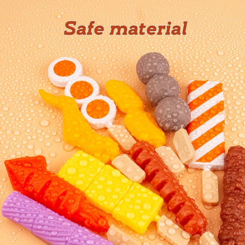A colorful set of mini barbecue food items including sausages, cheese sticks, and other pretend play food for kids
