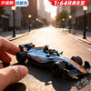 A hand holds a blue and orange 1:64 scale alloy RC drift car on an asphalt road.