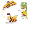 A yellow and brown 3D paper animal puzzle set shaped like a bee, displayed next to its packaging.