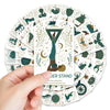 A hand holds a deck of yoga pose affirmation cards featuring various animal and nature motifs.