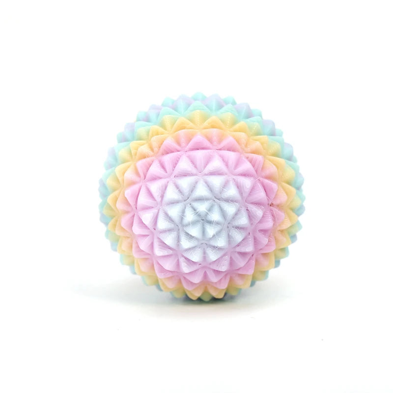 A spherical fidget roller keychain with a pastel rainbow gradient texture.