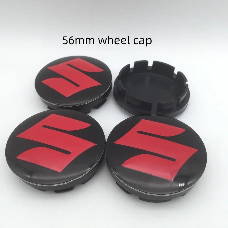 Two 56mm red and black Suzuki wheel cap hub center caps are displayed on a white background.