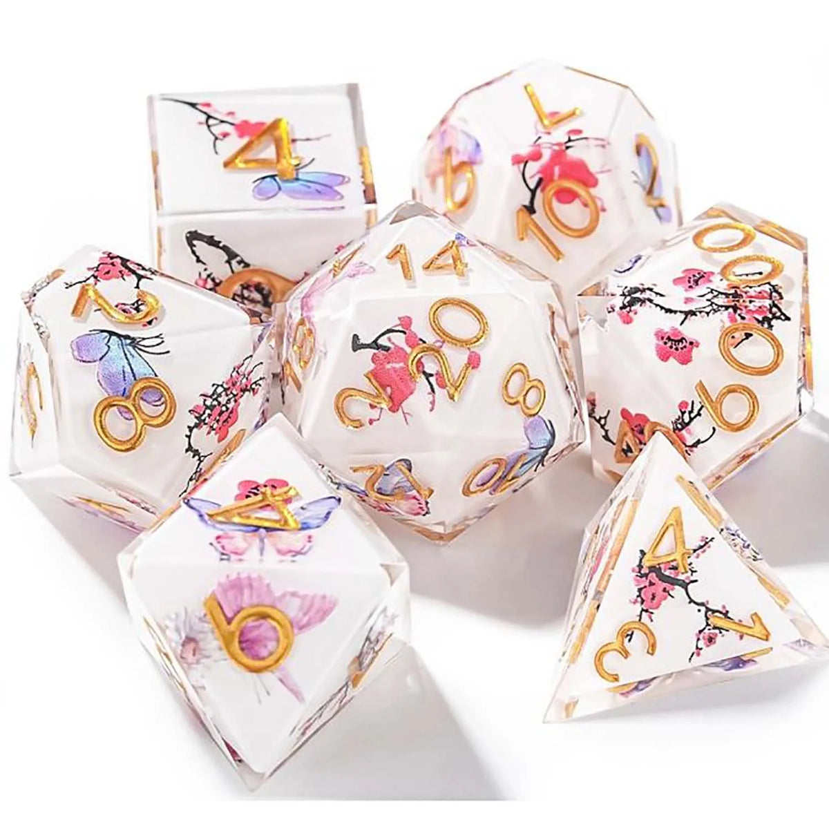 A set of seven pink floral butterfly resin polyhedral dice for tabletop role-playing games