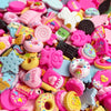 Assorted pink and pastel candy resin flatbacks for DIY crafts and jewelry making