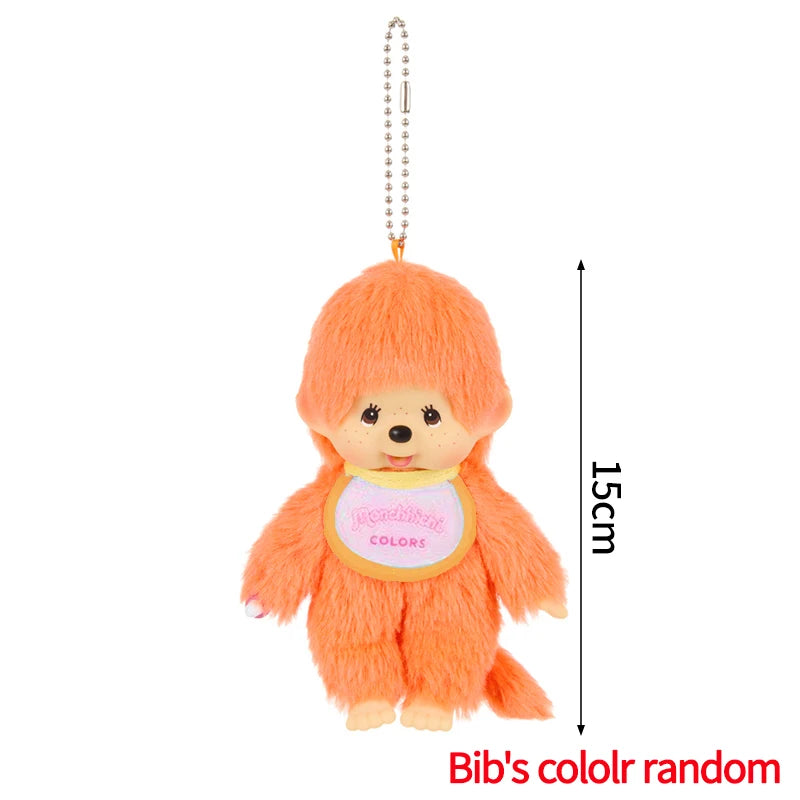 An orange fluffy cartoon plush toy with a yellow collar and a silver chain.