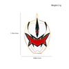 A gold-colored enamel pin featuring a stylized dinosaur ranger helmet design with black and red accents.