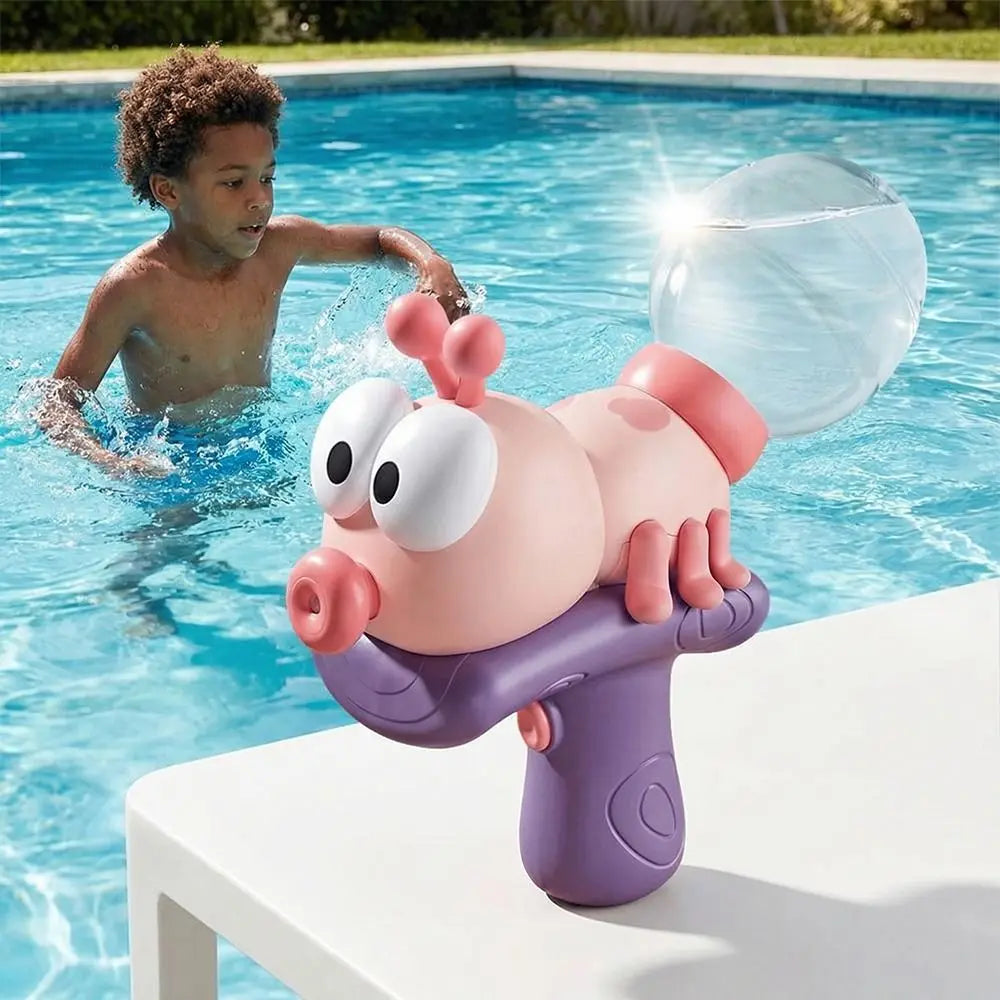 A pink ant-shaped water blaster toy is being held by a young boy in a swimming pool.
