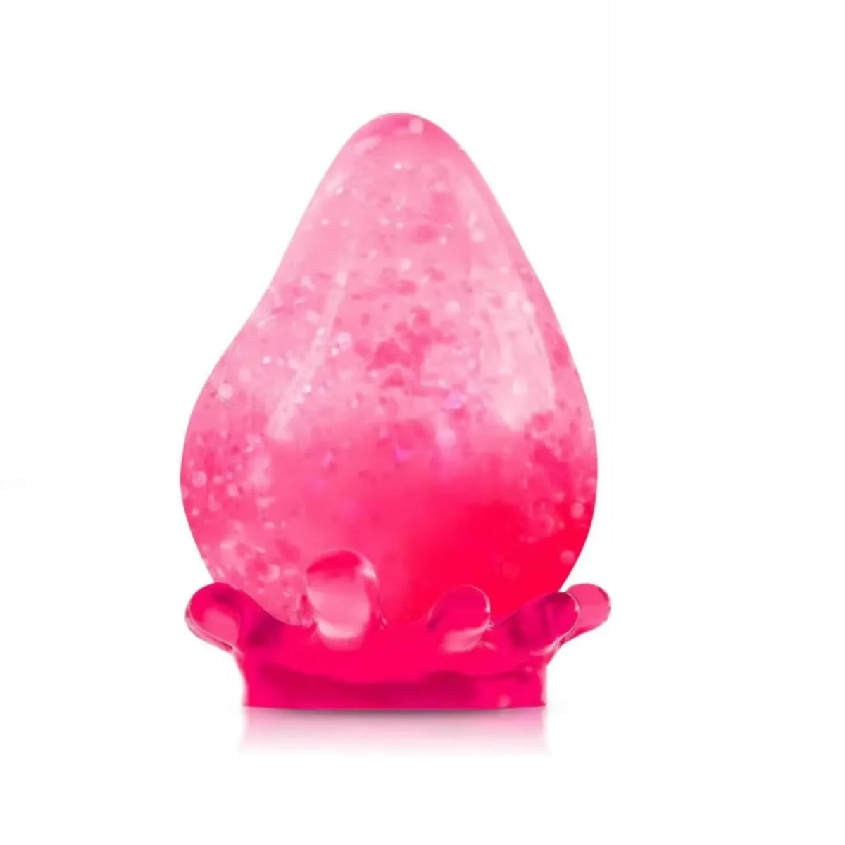 A translucent pink, teardrop-shaped silicone squishy stress ball resting on a white surface.