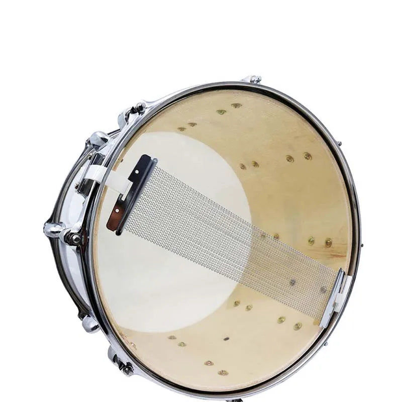 Close-up view of a snare drum showing wire strands for tuning or replacement.