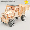 A wooden model kit of a solar-powered truck or vehicle with large wheels and a cab.