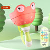 Pink pull-string flying disc toy with a frog head and green base, shown against a light green background.