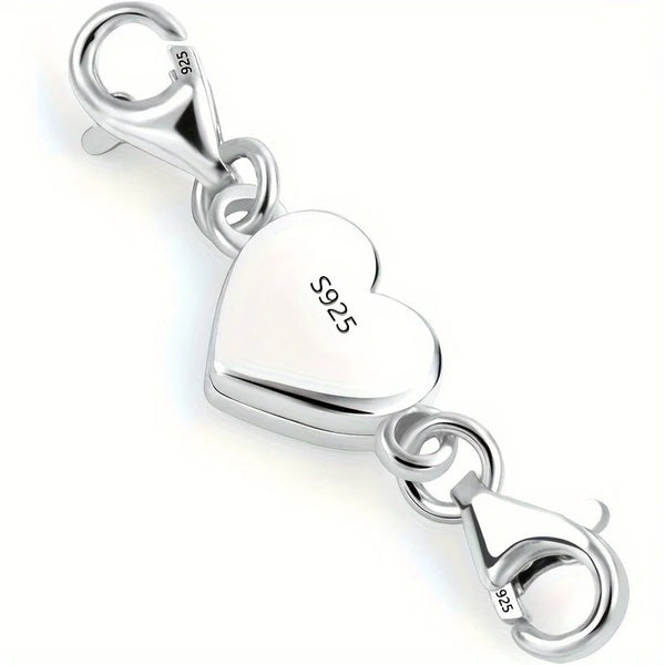 Silver heart-shaped magnetic clasp necklace with a bail and jump ring.