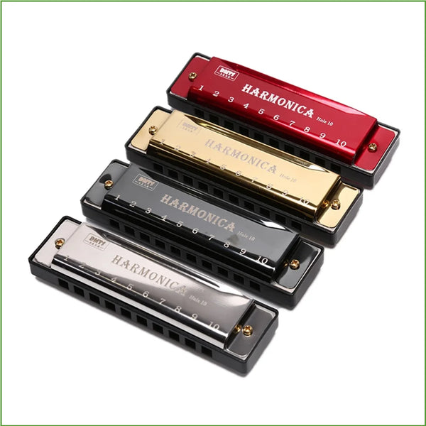 Three diatonic harmonicas in red, gold, and black are displayed diagonally.