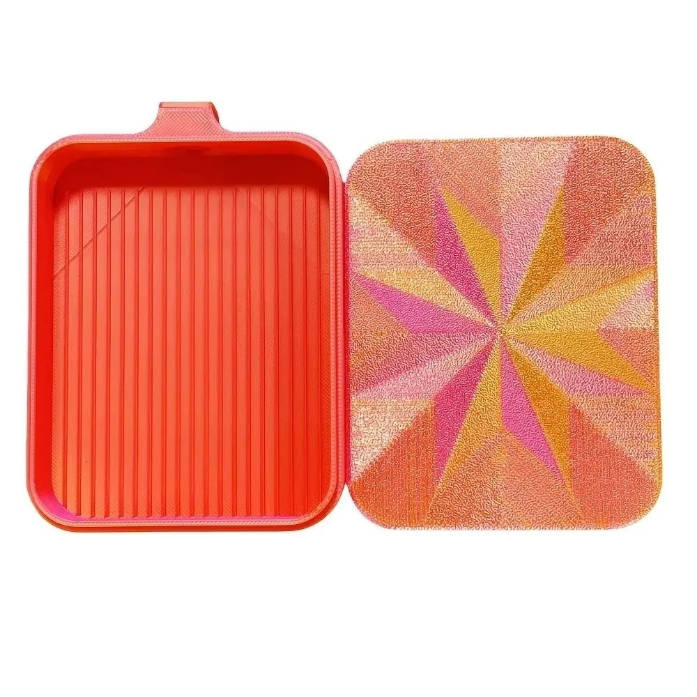 An orange plastic diamond painting tray with a pink pop-up plug for bead sorting.