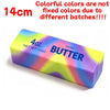 A rectangular block of salted butter, 4 oz net weight, with colorful stripes.