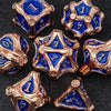 A set of ten premium zinc alloy metal dice in gold and blue are displayed on a dark surface.