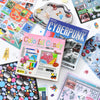 A collection of colorful die-cut stickers featuring cyberpunk and cute themes on various surfaces.