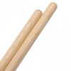 A pair of light wood maple drumsticks shown diagonally against a white background.