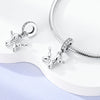 Sterling silver charm beads and a bracelet making kit displayed on a white surface.