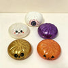 A set of three Halloween squishy fidget balls featuring a glitter pumpkin, an eyeball, and a skull.