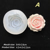 A white silicone mold with a rose design and a finished pink rose flower.