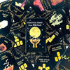 A collection of black and gold oracle cards featuring a central yellow moon symbol and various mystical illustrations.