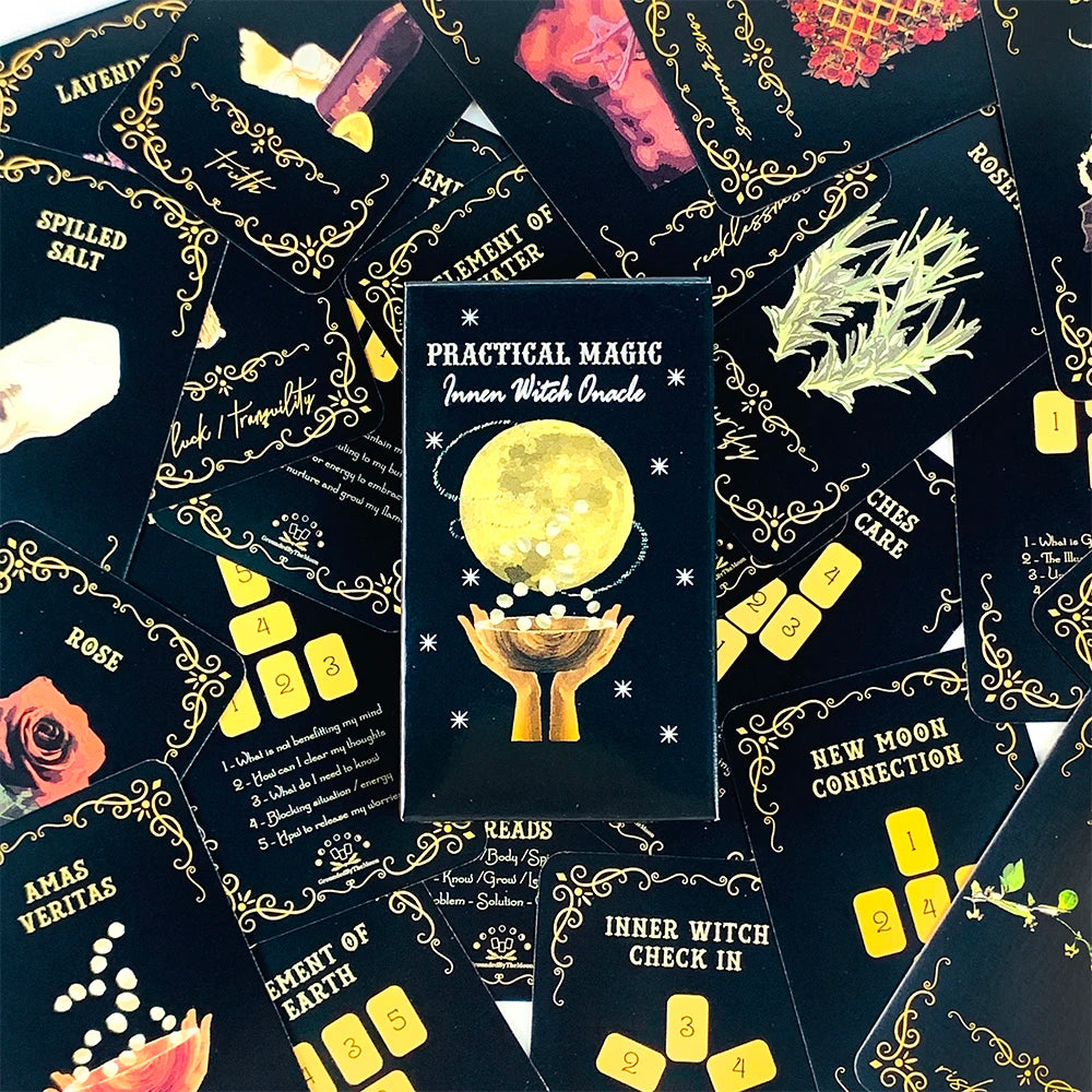 A collection of black and gold oracle cards featuring a central yellow moon symbol and various mystical illustrations.