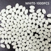 A pile of white luminous fishing beads for sea and river lures.
