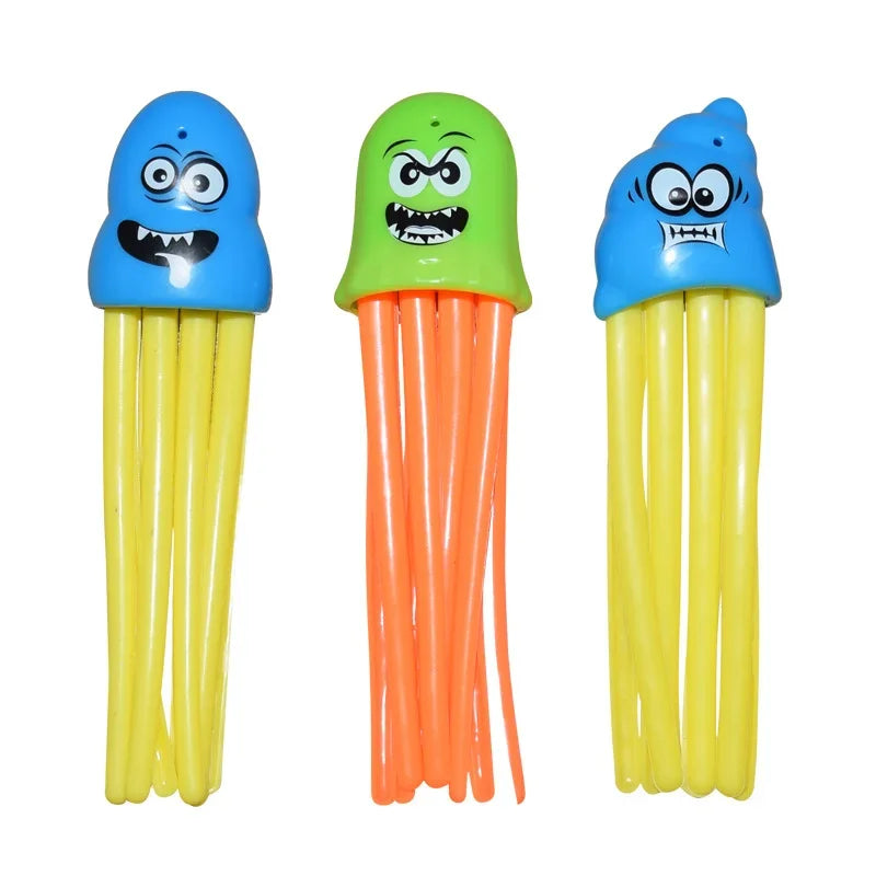 Three plastic shark rocket pool diving toys in blue, green, and orange.