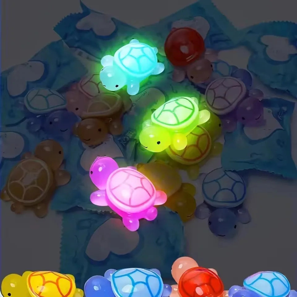 A collection of glow in the dark mini turtle collectible figurines in various colors and shapes.