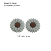 A pair of light gray silicone daisy sunflower beads used for DIY jewelry making.