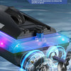 A black RC speedboat with dual motors is shown moving through water, creating a splash.