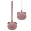 A pink silicone panda-themed pacifier storage bag with a long strap.