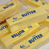 Yellow butter sticks packaged in plastic bags for stress relief or fidget toys