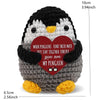 Handmade crochet penguin doll with a heart-shaped card that reads When penguins find their mate they stay together forever