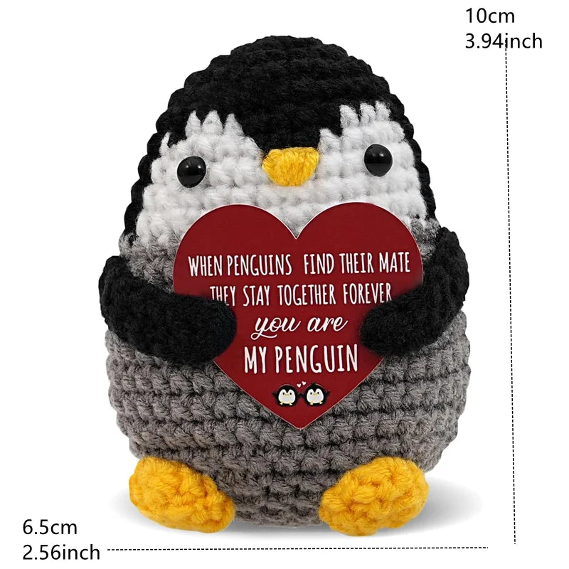 Handmade crochet penguin doll with a heart-shaped card that reads When penguins find their mate they stay together forever