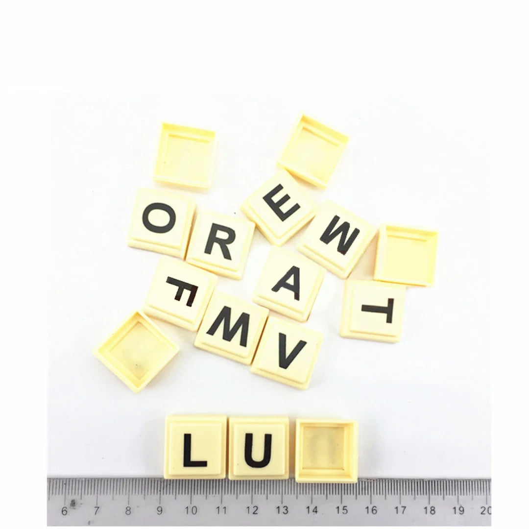 A set of yellow alphabet letter blocks spelling the word ORFAMILY for a game.