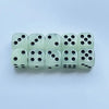 A set of ten glow-in-the-dark dice in a light green color arranged in a row.