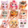 A collection of miniature pet animal figures in various colors and styles with accessories