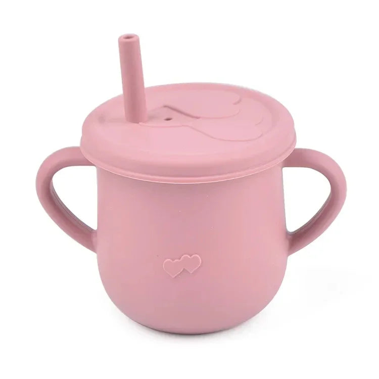 A pink BPA-free silicone snack cup with a lid is shown.