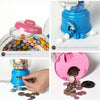 Instructions for using a kids candy dispenser piggy bank with gumball fun, showing how to open and take coins.