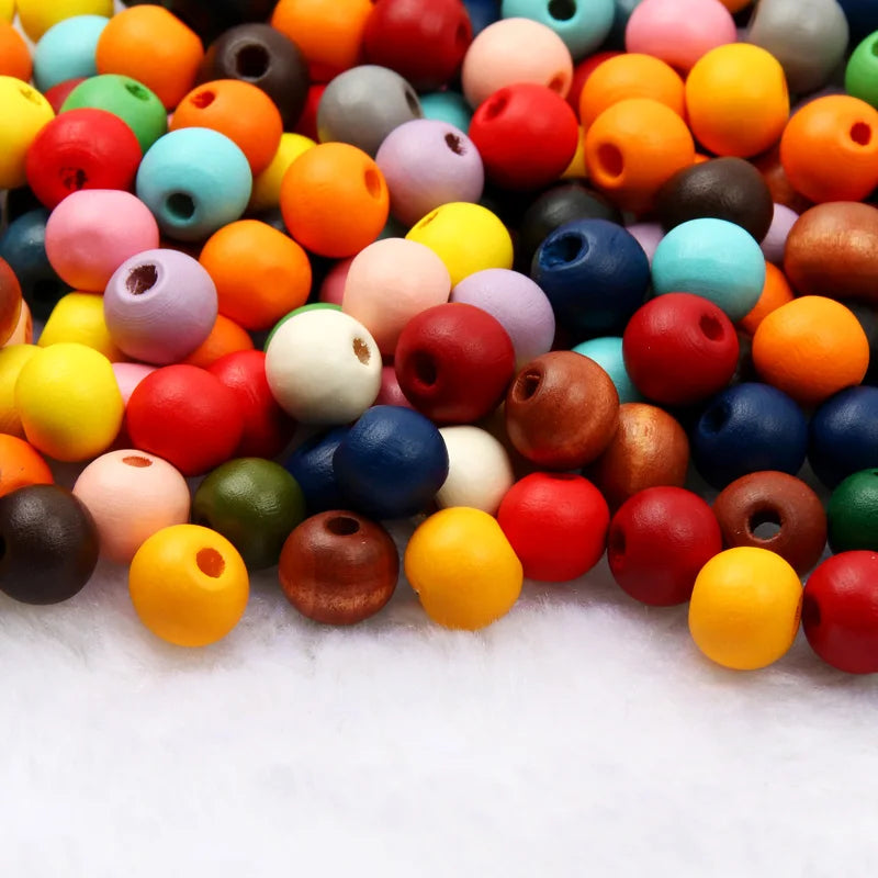 A colorful assortment of natural wooden beads in various shades and sizes for jewelry making and DIY crafts